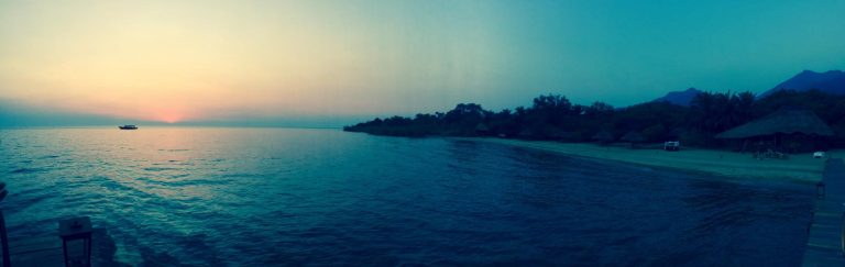 Panoramic teal dusk over lake with boat, Mahale Mountains National Park, Tanzania